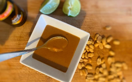 satay sauce in a pot with peanuts