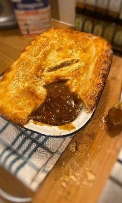 steak pie in a pie dish